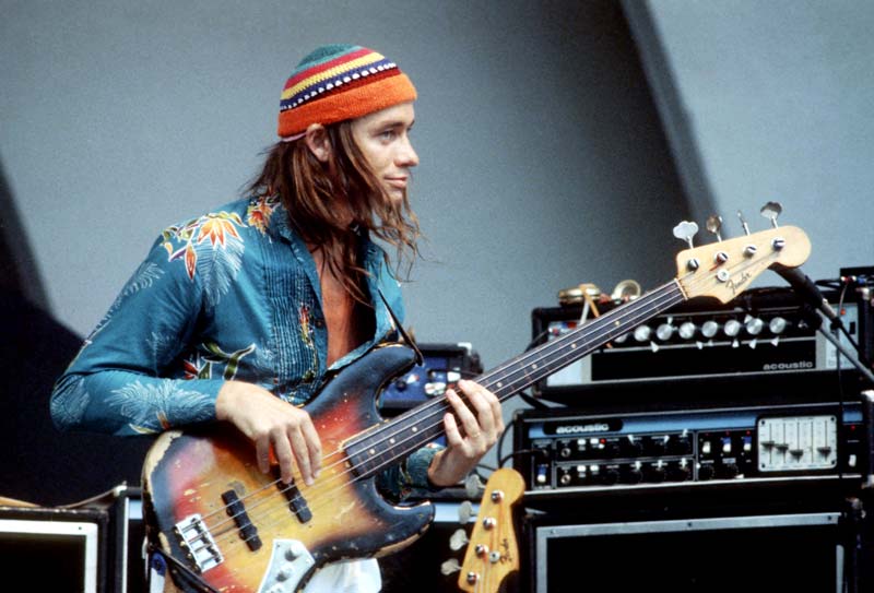 Colour portrait of musician Jaco Pastorius playing live in the 70s