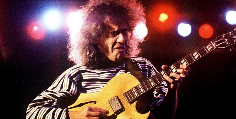 Colour portrait of guitarist Pete Metheny playing live