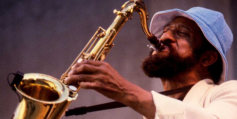 Colour photograph of Sonny Rollins playing the saxophone.