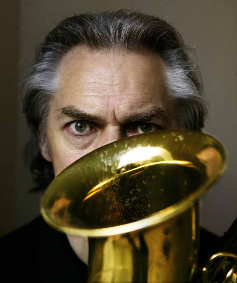 Colour close up portrait of jazz musician Jan Garbarek with Saxophone